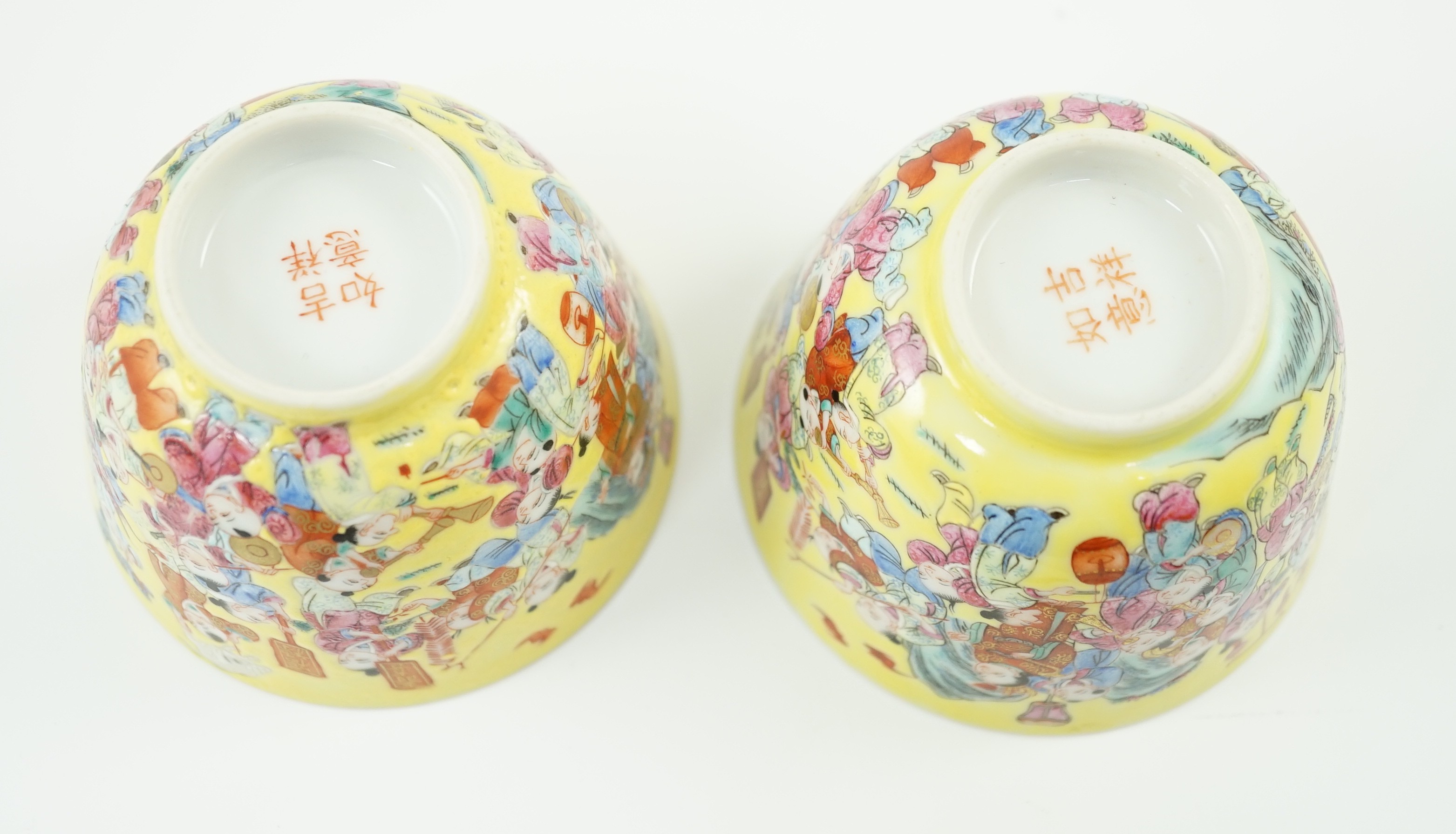 A pair of Chinese yellow ground 'Hundred Boys’ cups, 19th century, 6.5cm high 8.5cm diameter